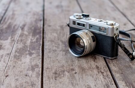 Old camera on wooden backgroundの写真素材