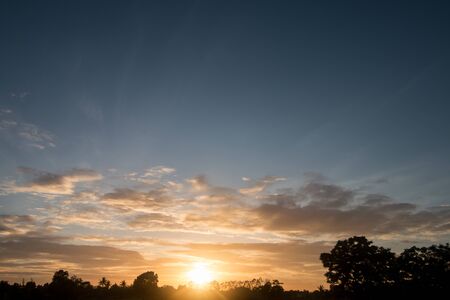 sunset over the field in countryside background