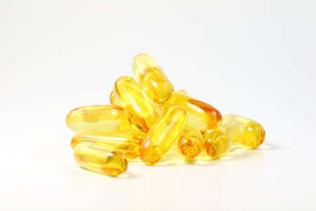 Fish oil capsules isolate on whiteの写真素材