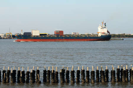Large container ship leaving portのeditorial素材