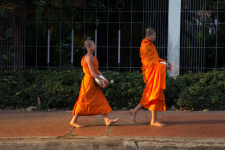 Unidentified Buddhist monks walking on streetのeditorial素材