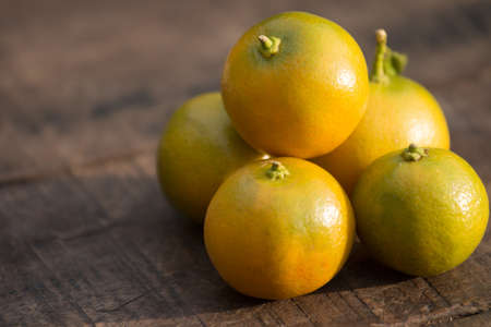 Orange fruit on wooden table