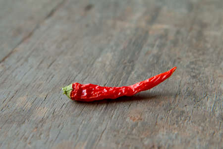 Dried Red chili pepper on wooden tableの写真素材