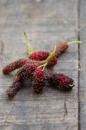 organic mulberry on wooden backgroundの写真素材