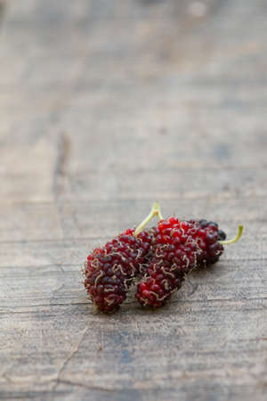 organic mulberry on wooden backgroundの写真素材