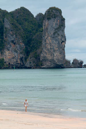 KRABI THAILAND  woman walking on AO NANG beach on Apr 16 2014 in Krabi Thailandのeditorial素材