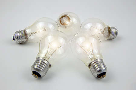 A light bulb or electric bulb with a bright orange color for creativity, startup, brainstorming and...