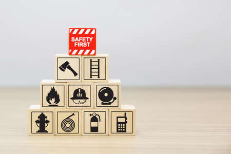 Wooded blocks Stacking with fire escape icon for safety concept.の写真素材