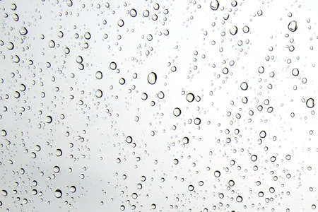 Water droplets on the glass when it rains for background and textured.