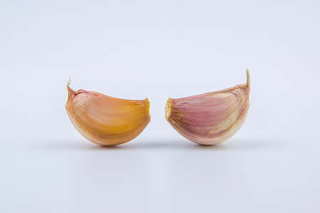Head and clove garlic isolated on a white background.の写真素材