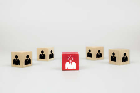 People icons on cube shape wooden toy blogs concepts human resources for business organizations and leadership.の写真素材
