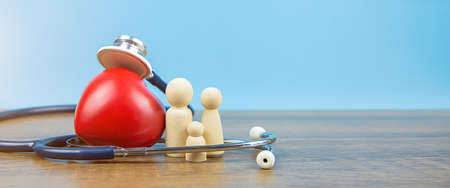 Family with stethoscope and a red heart. Concepts of a physical examination and health insurance.の写真素材