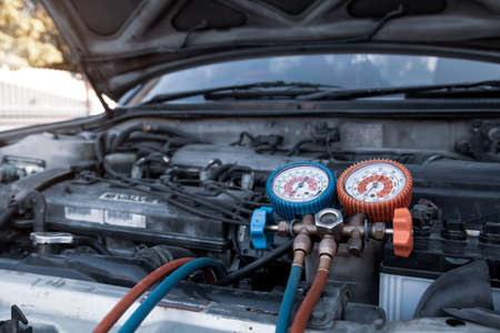 Close-up measuring equipment tool for filling car air conditioners fix checking. Concepts of Old car Repair service and insurance.の写真素材
