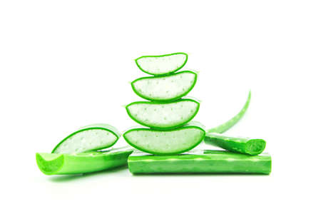 Slices of fresh aloe vera plant stacked and aloe vera stalk or leaves with water dropping isolate on white background.の写真素材