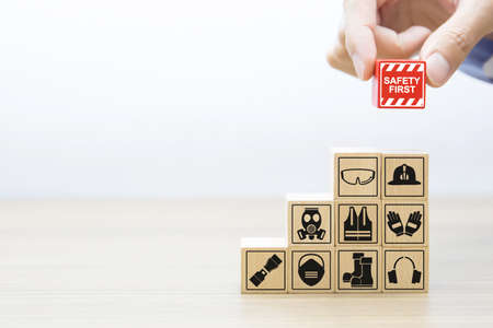Wooded blocks stacked with fire and emergency icon for safety concept.の写真素材