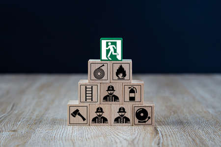 Wooded blocks Stacking with fire escape icon for safety concept.の写真素材