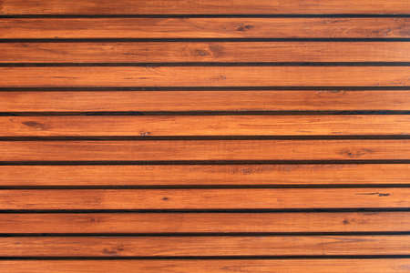 Old vintage red brown wood lath wall cladding for background and texture images.の写真素材