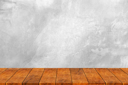Wooden shelf with raw old cement concrete or plaster wall with stains and cracks for background and blank template for displaying products.の写真素材