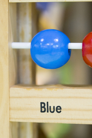 Blue circle - Wooden toys to learn and play with shapes and color (selective focus)の写真素材