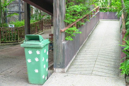 Green Plastic Container or Recycle Bin near walk way In The Zoo Parkの写真素材