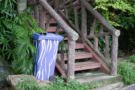 Blue Plastic Container or Recycle Bin near Old Stairs In The Parkの写真素材