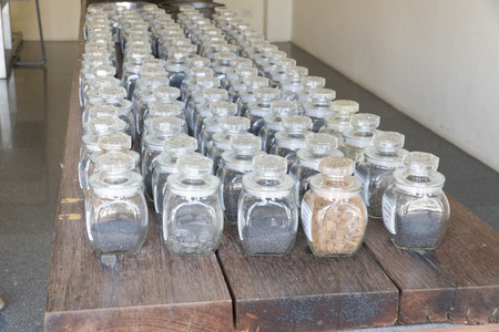 Collage of rocks and minerals, semiprecious stones in the glass jarsのeditorial素材