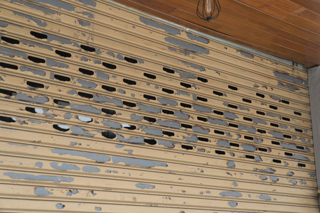 stainless rolling shutter door background, Old Slide door ,Roller shutter texture, Rusty stainless gate.の写真素材
