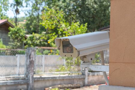 CCTV camera or outdoor security cameras on a wall, video protection safety system guardの写真素材