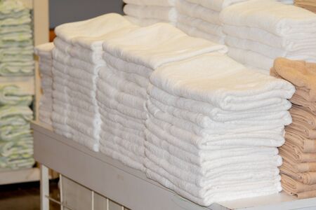 Clean White Towels and Brown Towels on shelfの写真素材