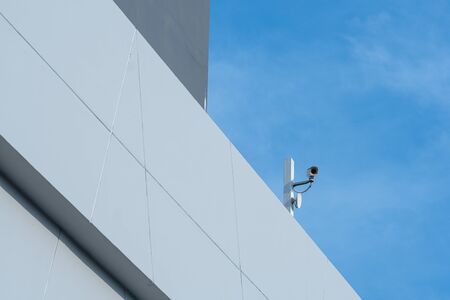 Security CCTV camera or surveillance system in office buildingの写真素材