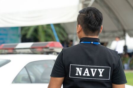 Men in the form of Thai Navy security personnel stand readyの写真素材