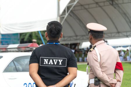 Men in the form of Thai Navy security personnel stand readyの写真素材