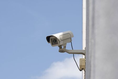 outdoor security cameras in garden , on blue sky backgroundの写真素材