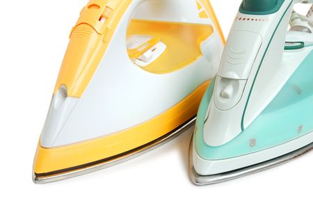 Two color irons on white backgroundの写真素材