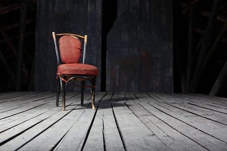 Old fashioned chair on wooden floorの写真素材