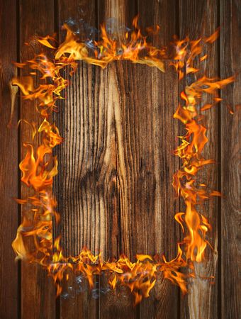 Old wood texture with fire frameの写真素材