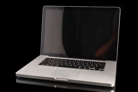 Aluminium laptop with desktop on black backgroundの写真素材