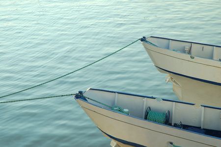 Piece of a catamaran on a blue sea background