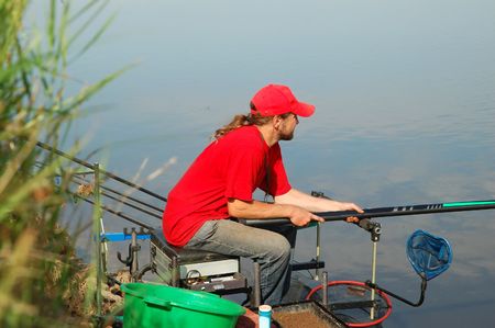 Fisherman on a beautiful riverの写真素材