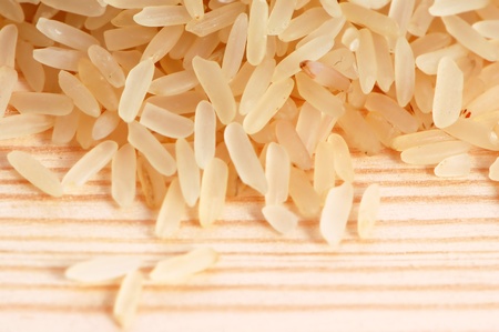 Rice seeds on a wooden backgroundの写真素材
