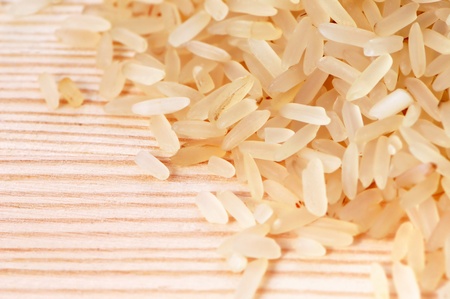 Rice seeds on a wooden backgroundの写真素材
