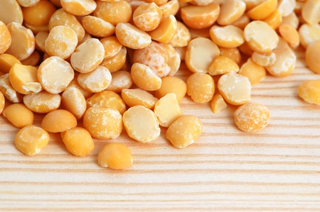 Split dried peas on a wooden backgroundの写真素材