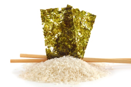 Rice, nori and chopsticks on  white background.の写真素材