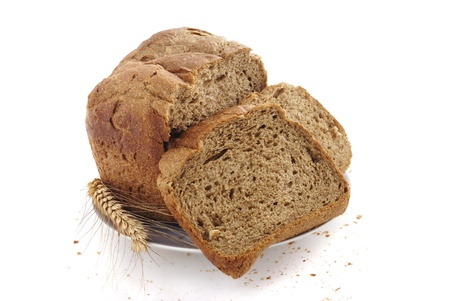 Homemade sliced bread on a plate on white background