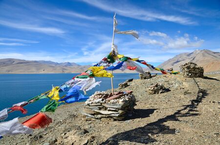 Tibetan prayer flags at lake Tso Moriri in Ladakh, Indiaの写真素材