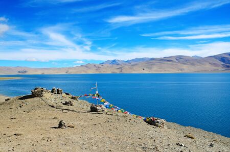Himalayas landscape with Tso Moriri lake and tibetan prayer flags, Ladakh, India.の写真素材