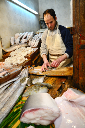 Fez, Morocco - March 5, 2014: Traditional moroccan fish store in Fez. Men selling fishes and seafood.のeditorial素材