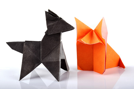 Origami paper wolf and fox isolated over white backgroundの写真素材
