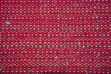 The weave multicolored threads of fabric closeup