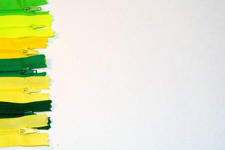 on a white background colored zippers
